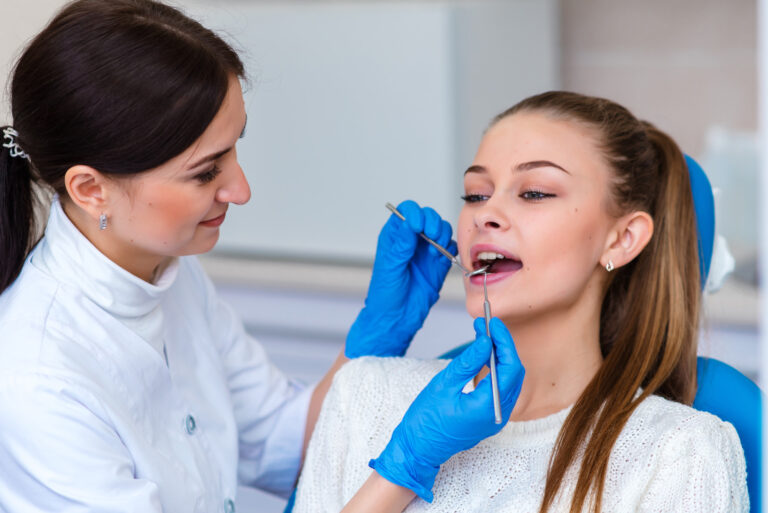 Dentist examining a patient's teeth in the dentist.