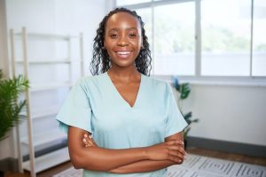 A female dental hygienist at a clinic, after completing her dental hygienist training
