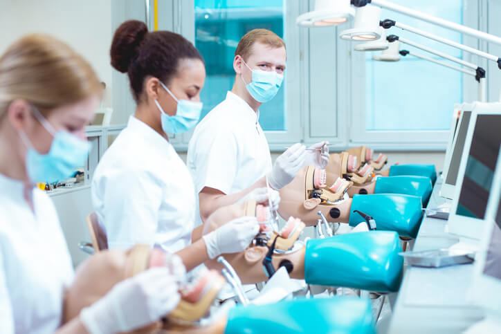 A group of dental assistant students during hands-on training