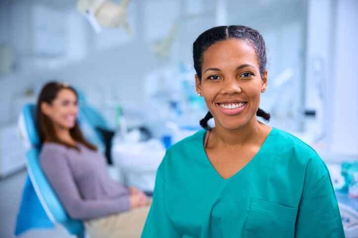 A graduate with a dental assistant diploma, starting their career in a dental clinic