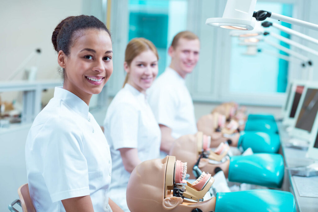 Future dental hygienists learning preventive oral healthcare techniques