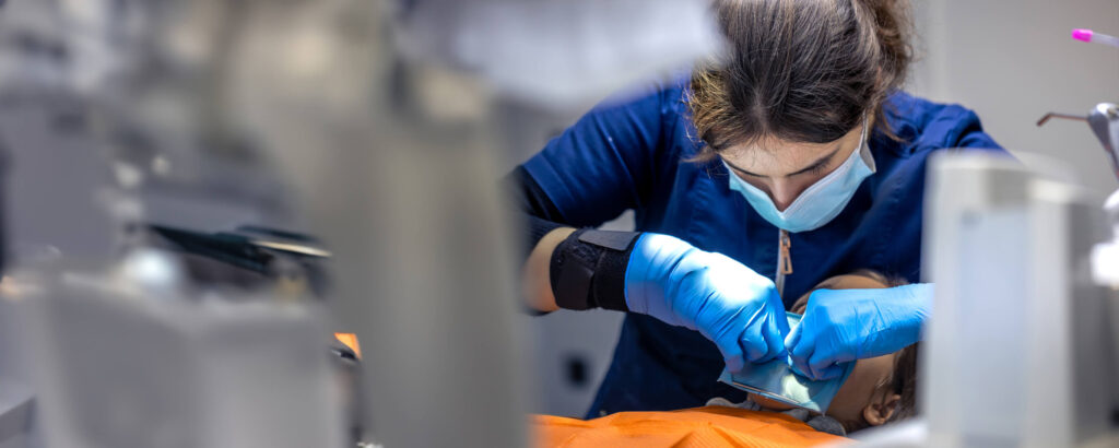 Dental hygiene student practising scaling techniques during clinical training