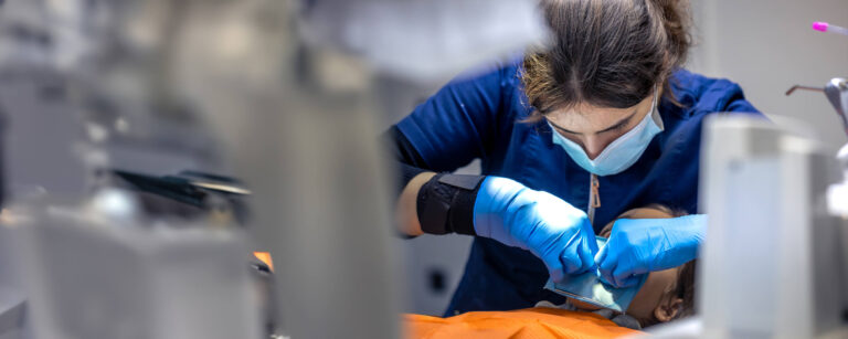 Dental hygiene student practising scaling techniques during clinical training