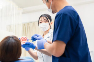Dental hygiene student providing supervised care in a dental hygiene clinic